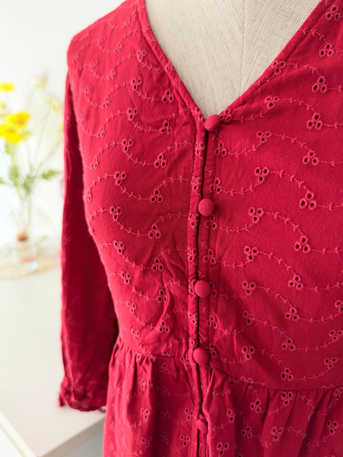 Red eyelet peplum top