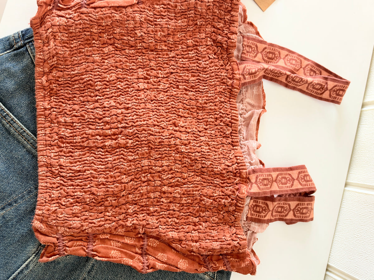 Orange smocked top