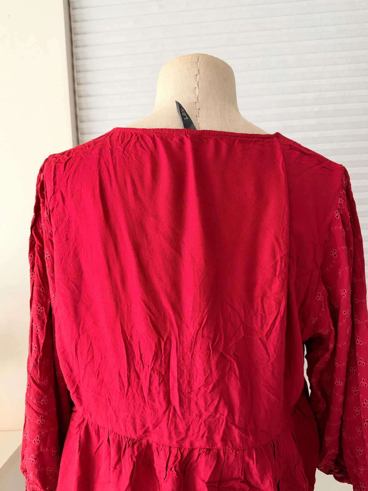 Red eyelet peplum top