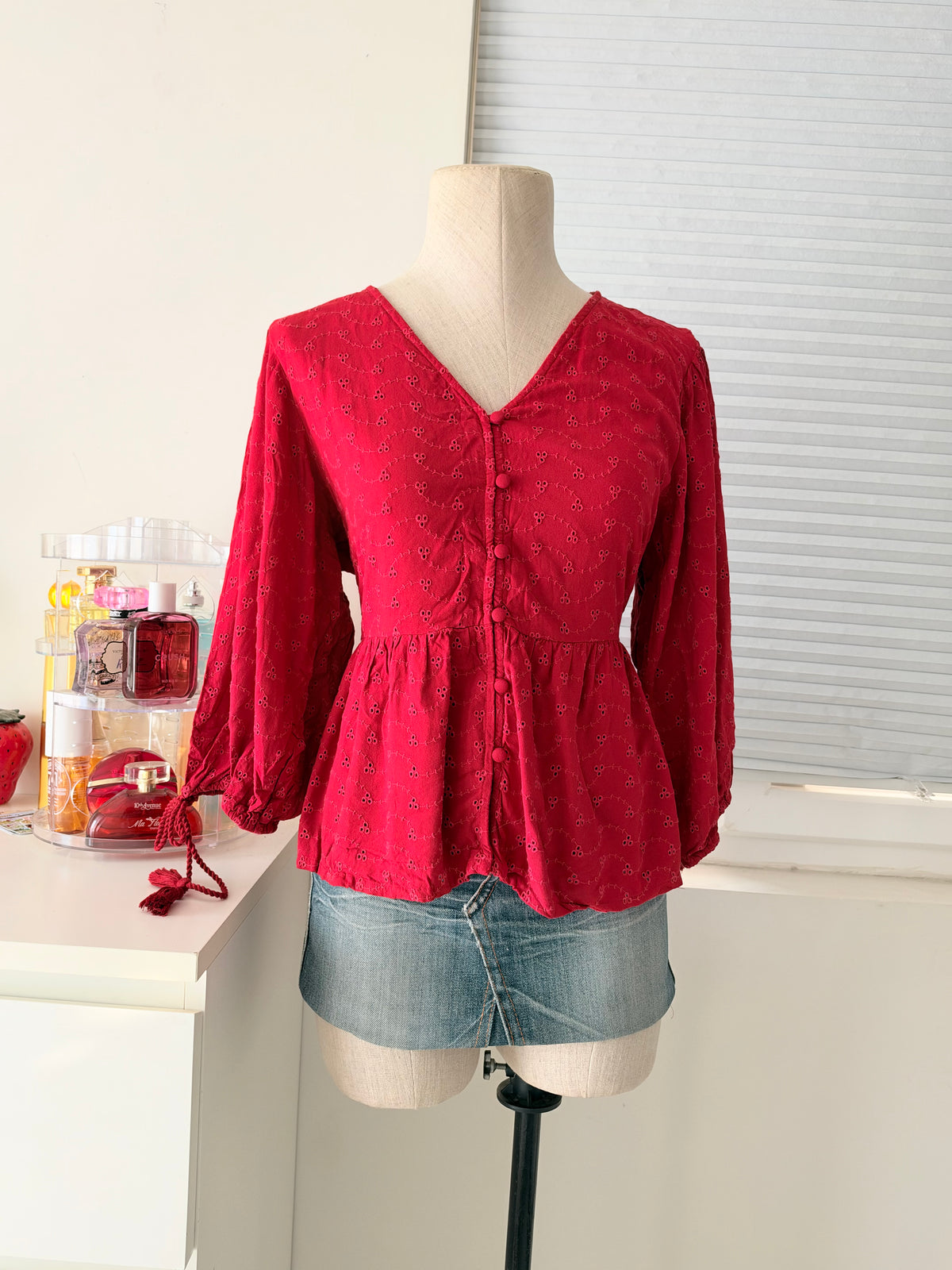 Red eyelet peplum top