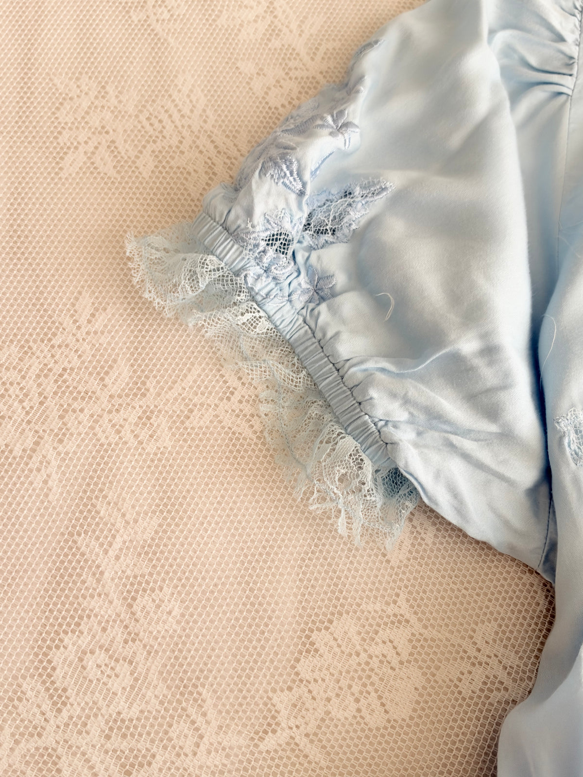 Blue embroidered satin top