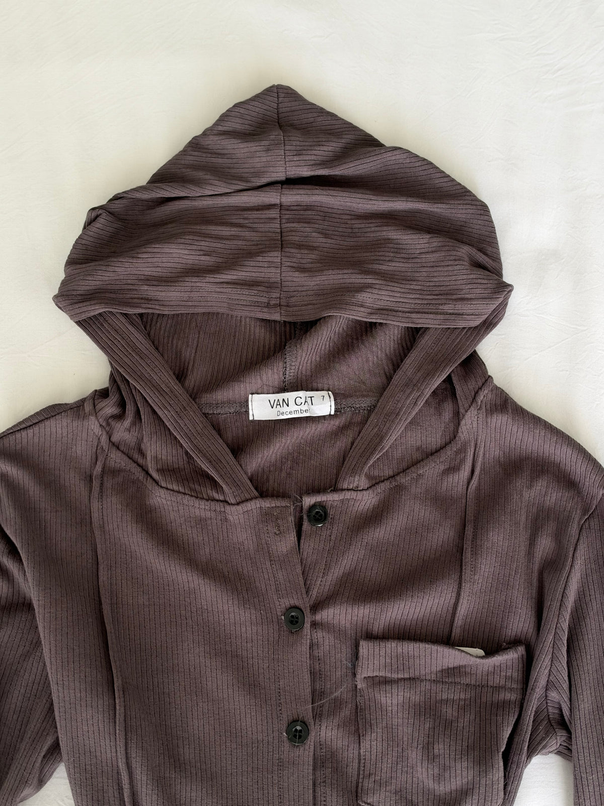 Grey hooded top
