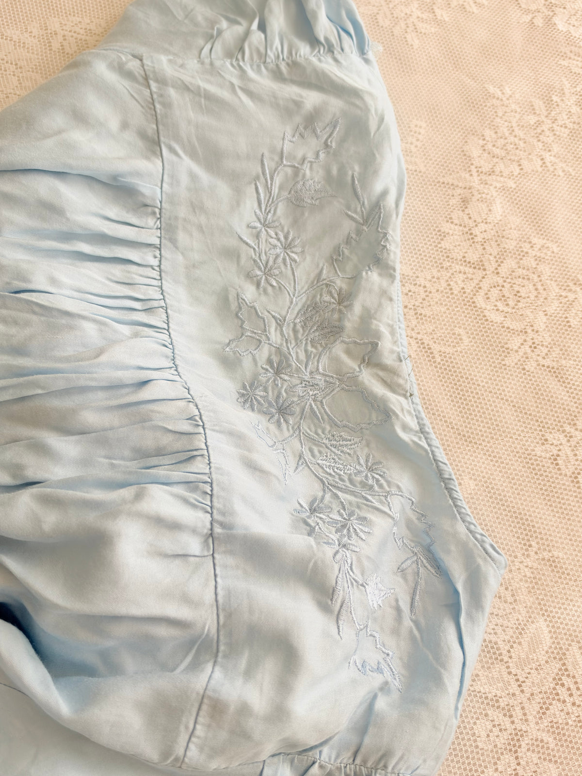 Blue embroidered satin top
