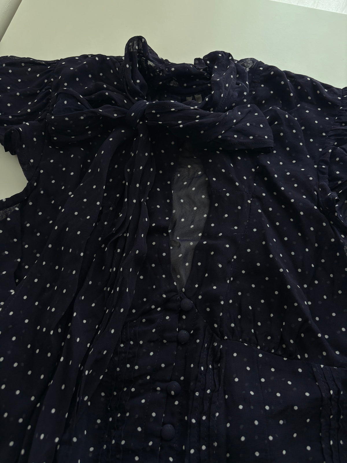 Navy polka tie top